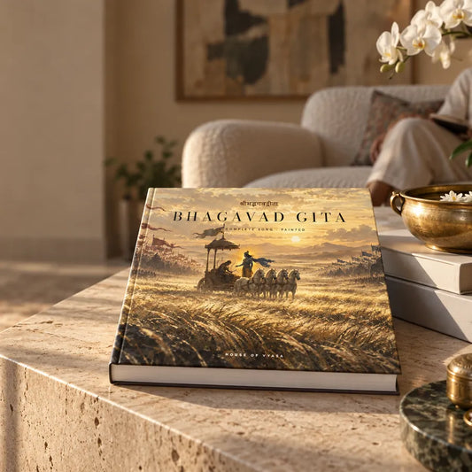The Bhagavad Gita art book on a travertine coffee table